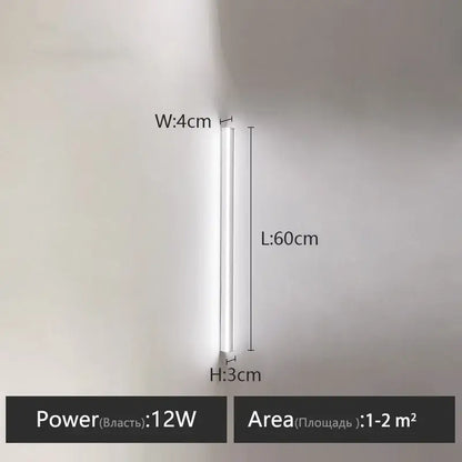 A sleek white 12w led wall lamp with slim cylindrical design ideal as a bedroom wall lamp for warm glow lighting