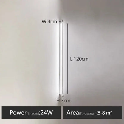 A sleek minimalist black linear led wall lamp with a slim white cylindrical body for bedroom wall warm glow
