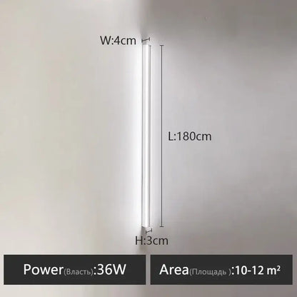 A sleek minimalist black linear led wall lamp with a slim white cylindrical design for a warm bedroom wall glow