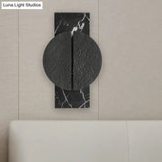 Minimalist black marble wall lamp with textured circular disc and white veining for living space 110v-120v 220v-240v use