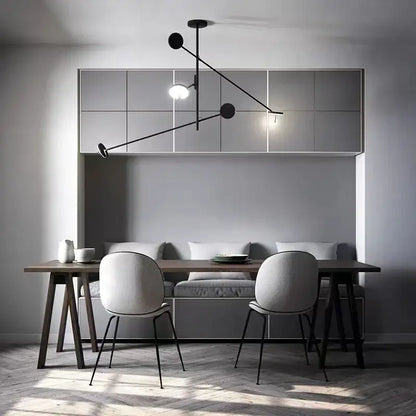 Minimalist black metal pendant light with spherical led fixtures for living room decorbites black metal design