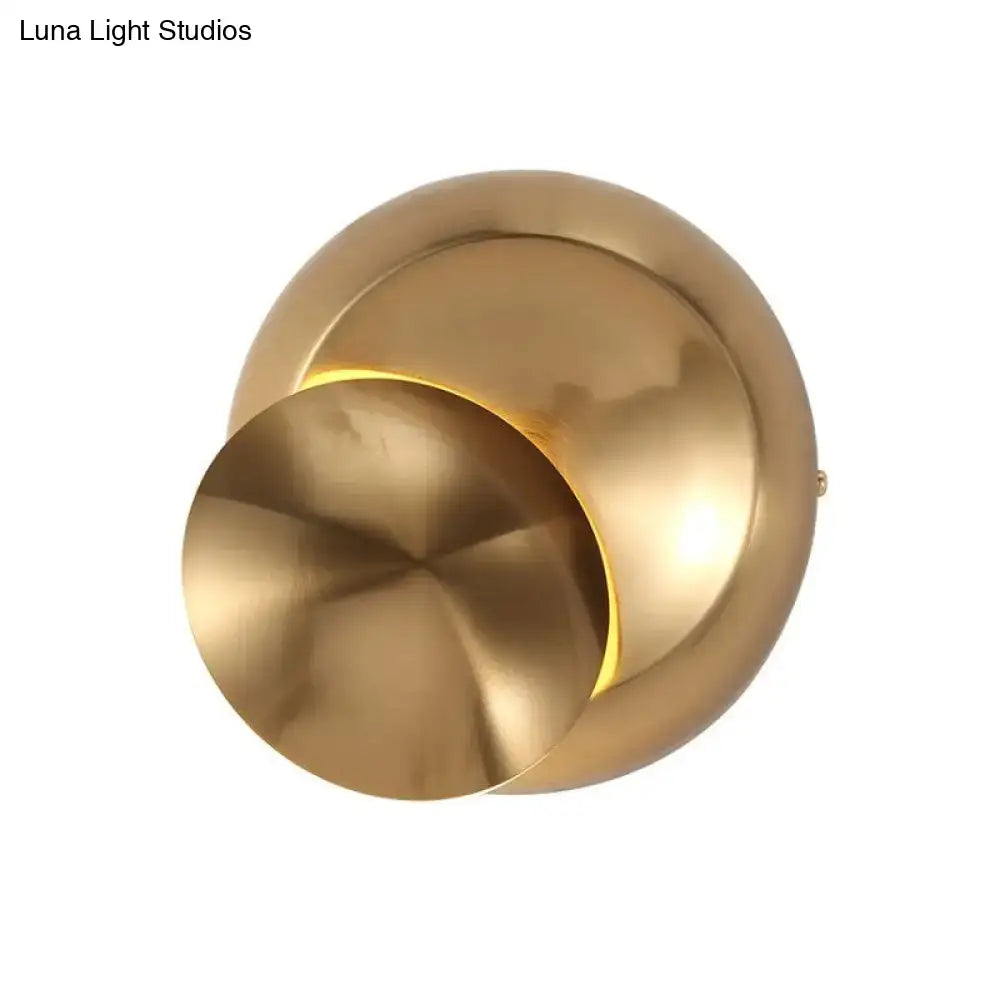 Minimalist black moon shaped sconce lighting with brass finish and warm ambient light for bedroom wall lamp