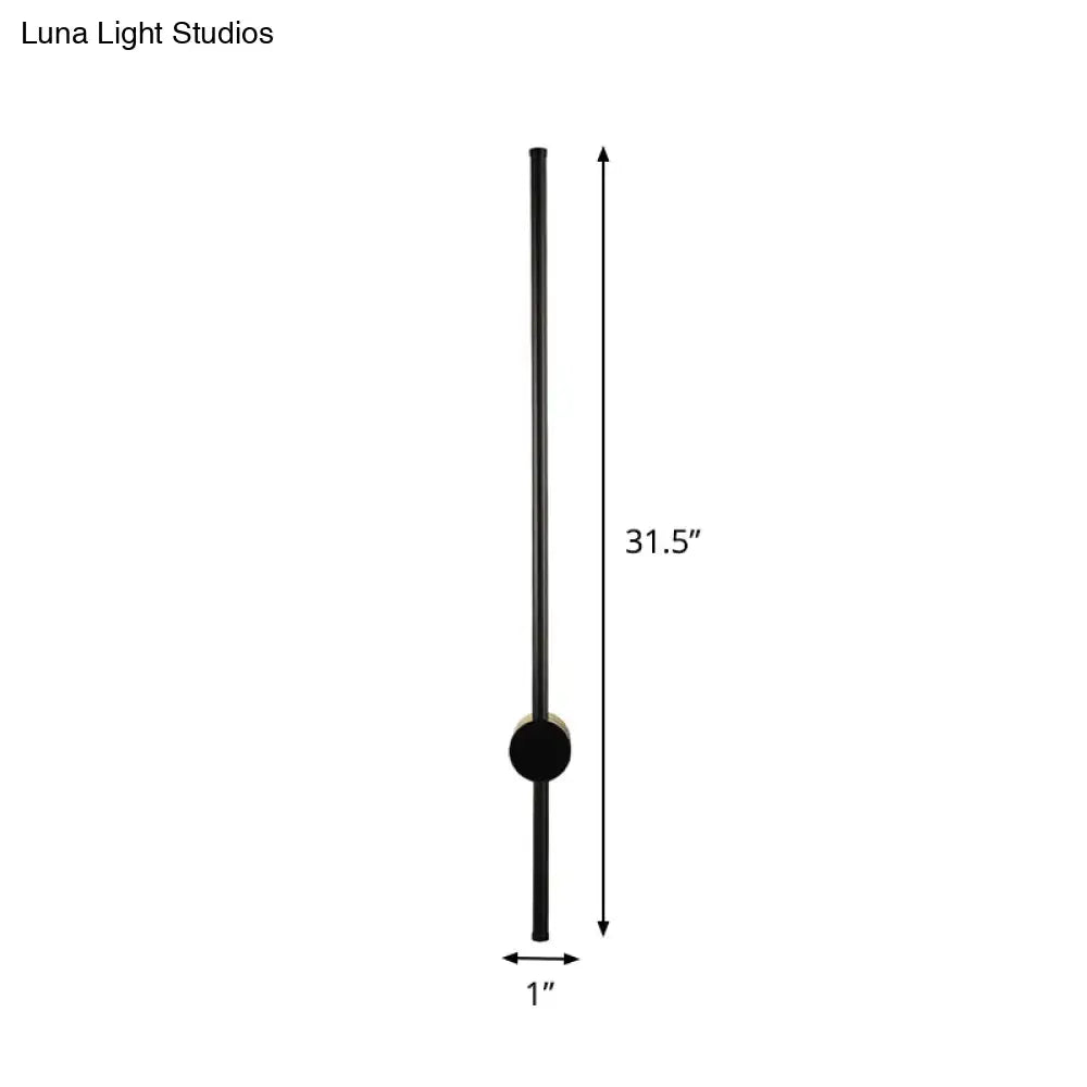 Minimalist black cylindrical wall light with matte finish and circular accent for 110v-120v bulb base sconce installation