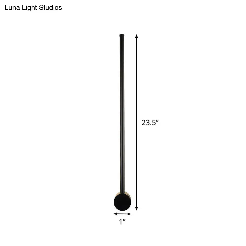 Minimalist black matte floor lamp with slender cylindrical shaft and circular base for 110v-120v wall light bulb base use