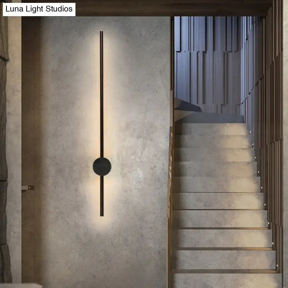 Minimalist black needle wall light with sleek vertical bar and circular accent for 110v-120v or 220v-240v bulb base use