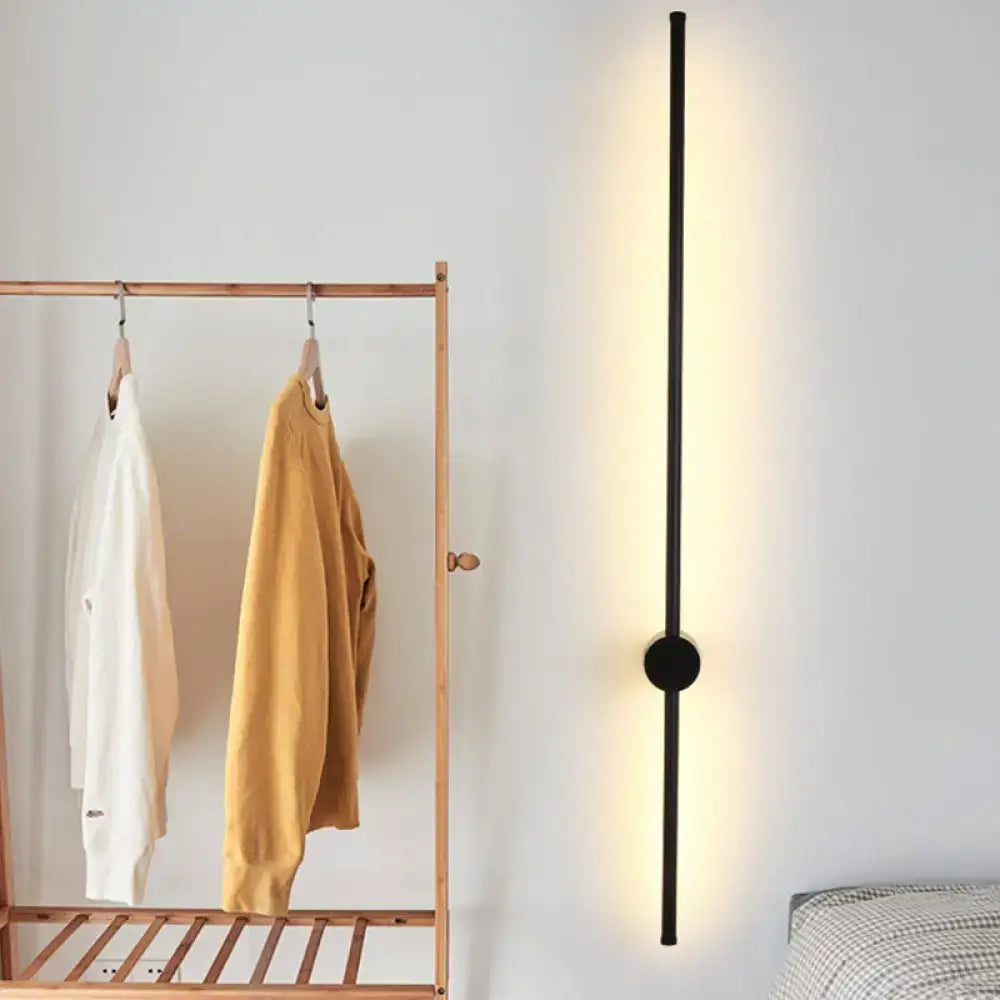 Minimalist black needle wall light with sleek vertical bar and circular bulb base for 110v-120v and 220v-240v use