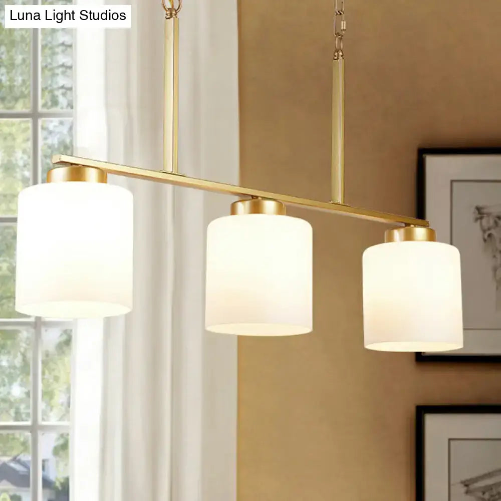 Decorbites minimalist metal frame pendant light with three gold-toned opal frosted glass shades for island lighting fixture