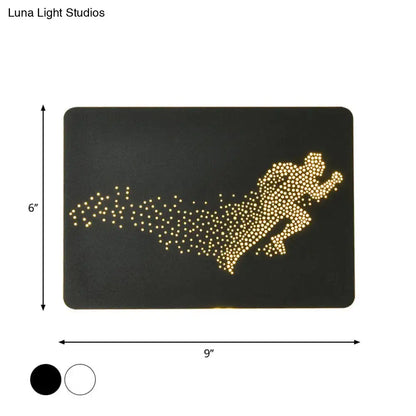 Minimalist black rectangular wall lamp fixture featuring a golden dot-patterned running figure 110v-120v bedroom light