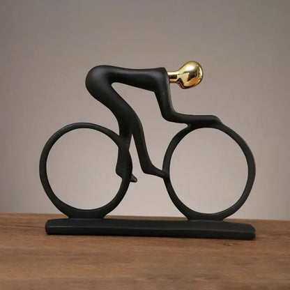 Minimalist black and silver cyclist sculpture figurine with gold head and glossy finish for living room decor by decorbites cyclist sculpture