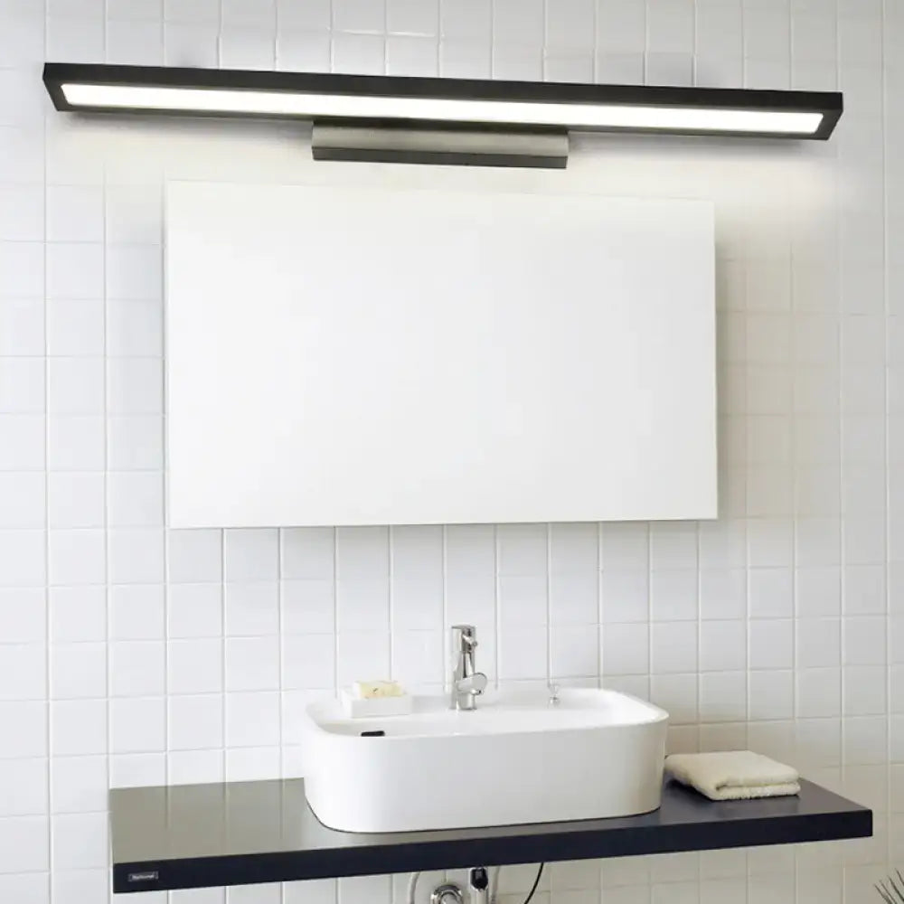 Minimalist black and silver bathroom vanity lamp with sleek rectangular design and metallic mounting bracket for bathroom vanity