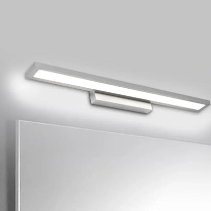 Minimalist black and silver LED bathroom vanity lamp with sleek rectangular design and smooth minimalist finish