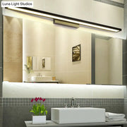 Minimalist black and silver bathroom vanity lamp with sleek rectangular LED mirror light and warm white illumination