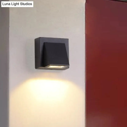 Minimalist black triangle aluminum flush wall lamp with sleek modern design and warm ambient lighting for corridors