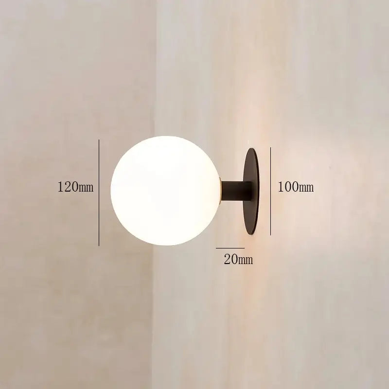 Minimalist black wall lamp with frosted white glass globe lighting fixture for bedroom by decorbites gold