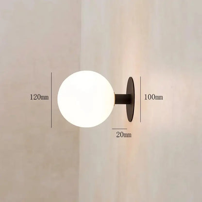 Minimalist black wall lamp with frosted white glass globe lighting fixture for bedroom by decorbites gold