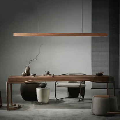 Minimalist black walnut log pendant light with sleek wooden table featuring smooth finish and curved legs for dining room decorbites black walnut