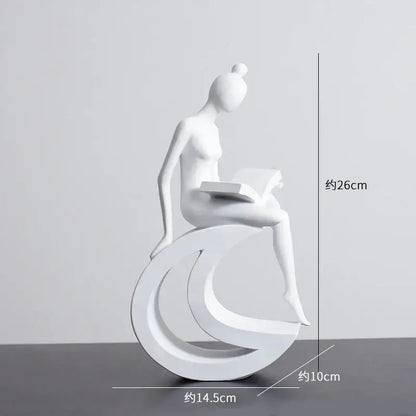 Minimalist black and white abstract resin sculpture of a woman reading on crescent base for living room decorbites abstract resin