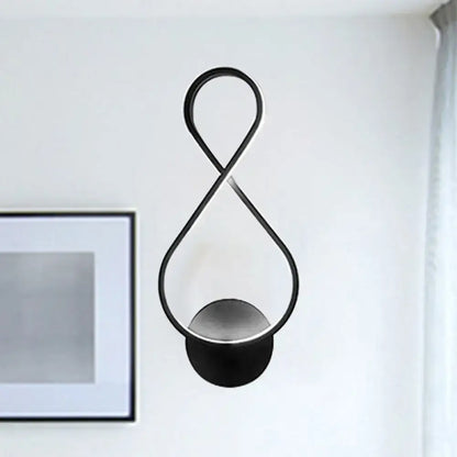 Black infinity-shaped acrylic led wall lamp with minimalist design and circular base for bedroom sconce in black and white