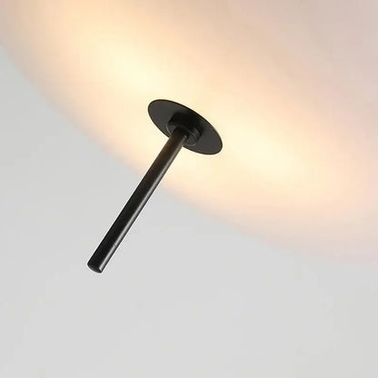 Minimalist black matte metal pendant light with circular base and slender stem for dining room acrylic pendant light