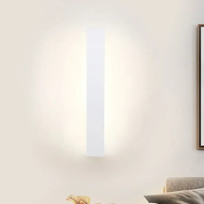 Modern white rectangular direct wired wall sconce with a minimalist black and white aluminum shade for bedroom use