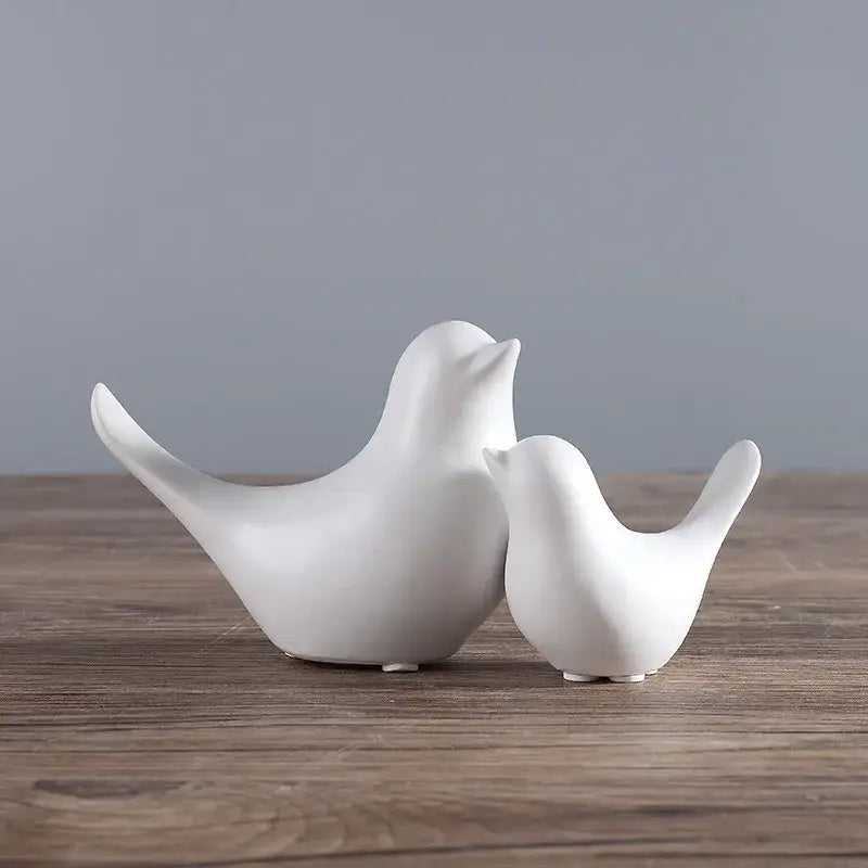 Minimalist black and white ceramic bird figurine set with smooth glossy surfaces for living room decor