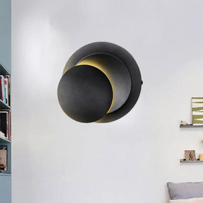 Minimalist black and white circular led wall lamp with a modern black matte inch fixture for stairway lighting
