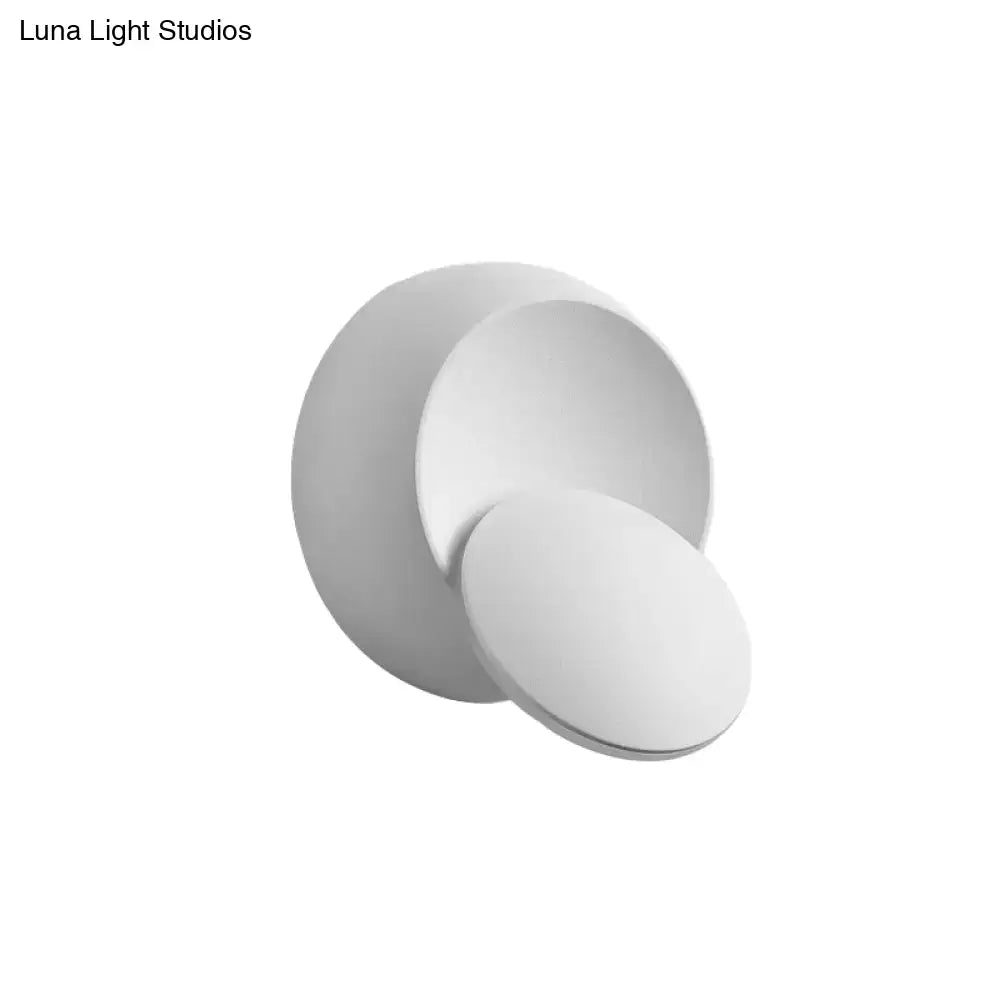 Minimalist black and white wall lamp with sleek overlapping circular design inch fixture for stairway lighting