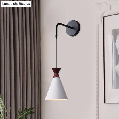 Minimalist black and white conical wall light with matte white shade and iron curved arm for bedroom use