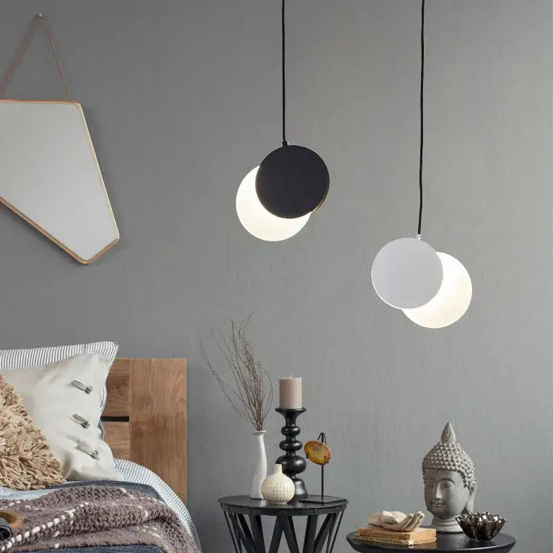 Minimalist black and white crescent moon pendant chandelier with sleek circular shades hanging on thin cords for bedroom decorbites crescent moon lighting