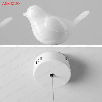 White ceramic bird chandelier with sleek glossy finish and minimalist design for dining room decorbites bird chandelier