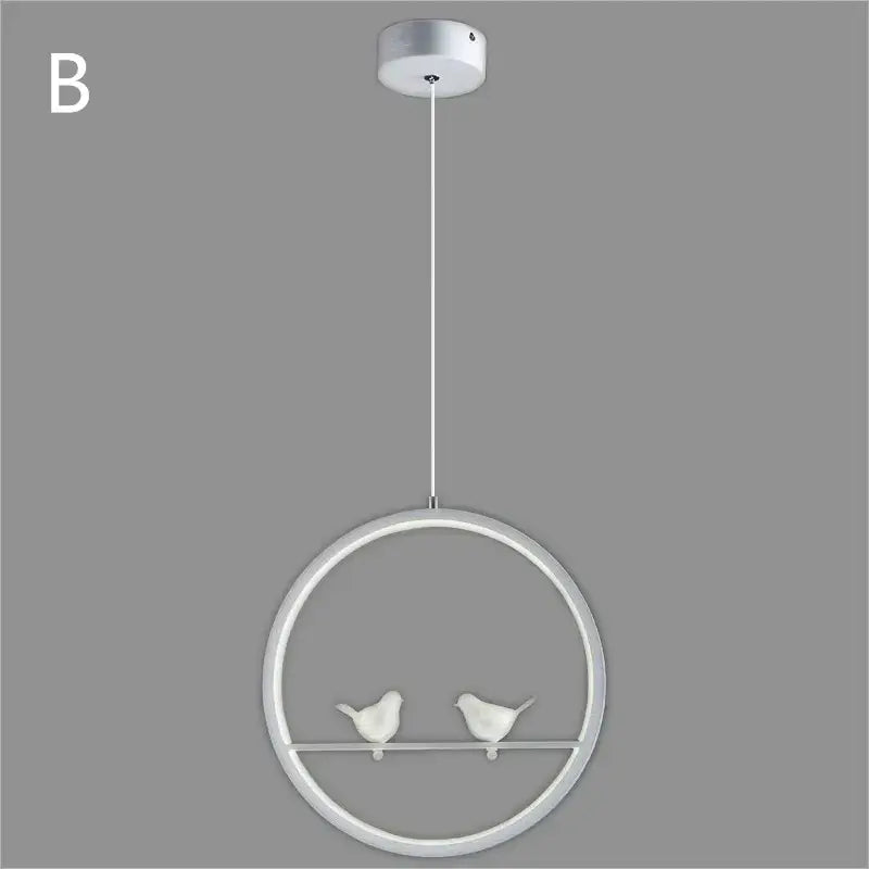 White circular pendant light with two small bird figurines on a horizontal bar inside the decorbites bird chandelier