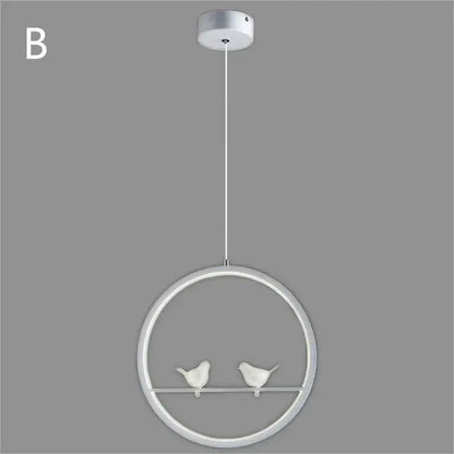 White circular pendant light with two small bird figurines on a horizontal bar inside the decorbites bird chandelier