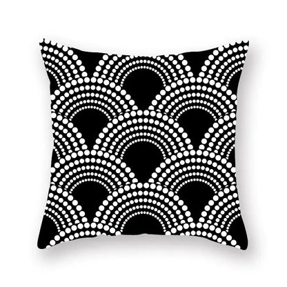 Black geometric cushion with bold white dot pattern in overlapping curved arches for minimalist living room decorbites decor