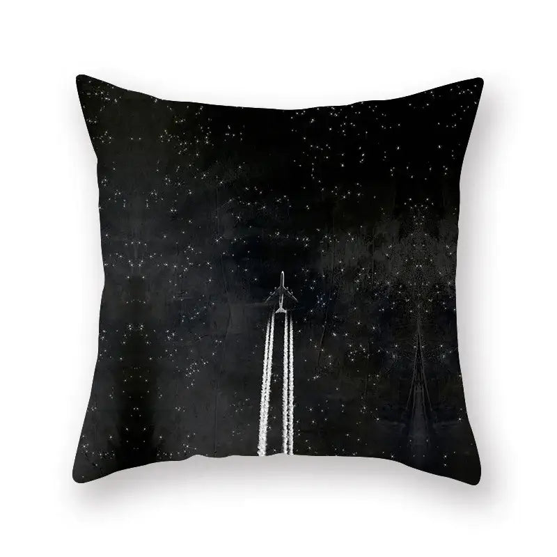 Black geometric cushion featuring a minimalist monochrome airplane print on starry night sky for living room decorbites decor