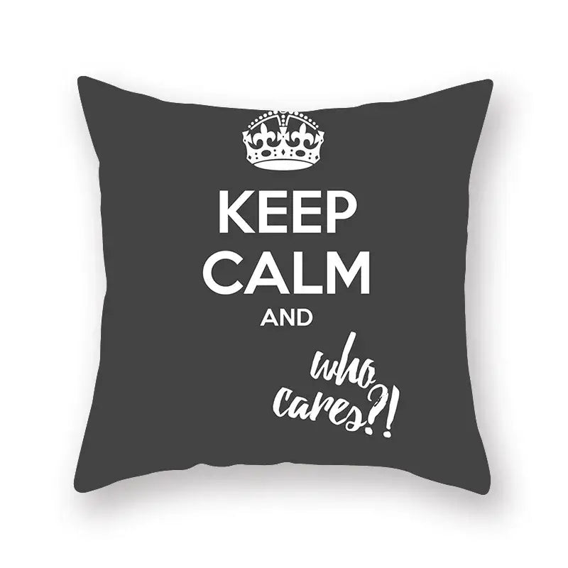 Dark gray throw pillow with white keep calm and who cares text and crown, decorbites black geometric cushion cover
