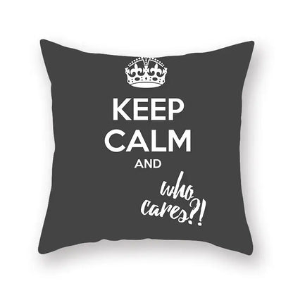 Dark gray throw pillow with white keep calm and who cares text and crown, decorbites black geometric cushion cover
