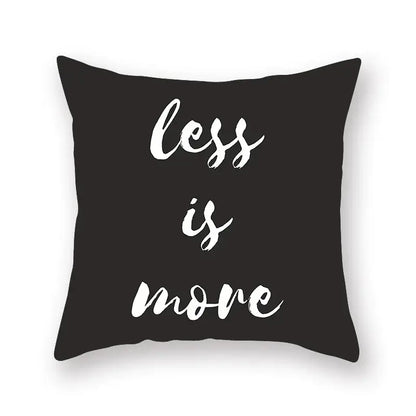 Minimalist black geometric cushion cover with white brushstroke text less is more for living room decorbites decor