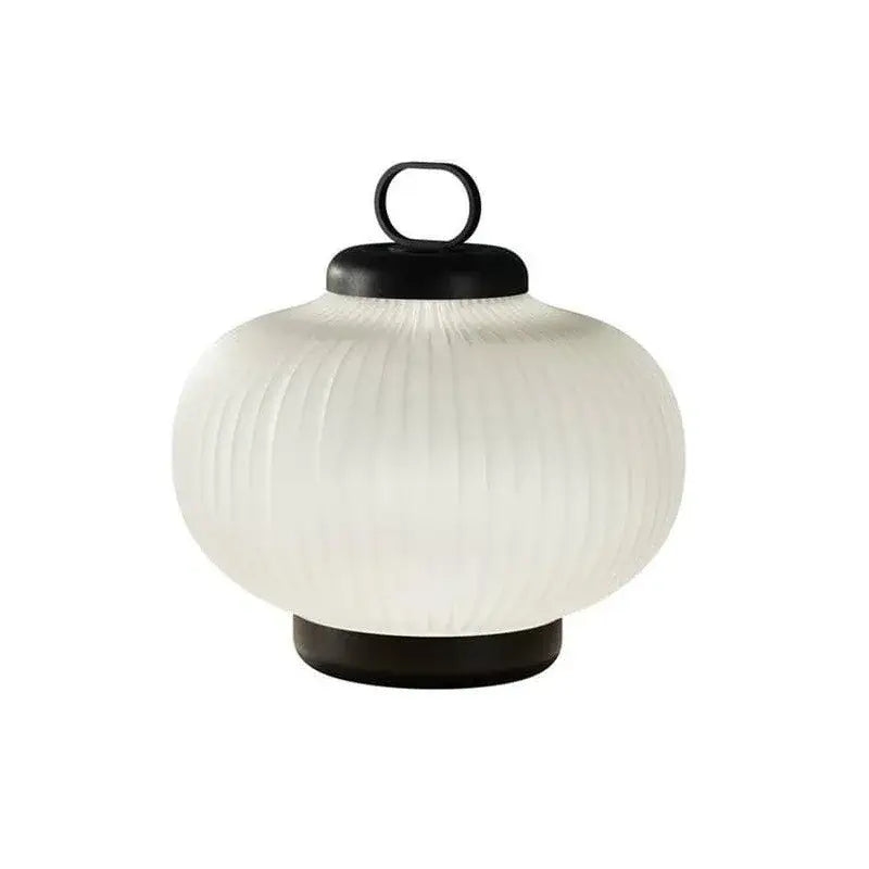 A minimalist black and white glass chandelier bedroom lantern light with an off-white ribbed white glass and black metal handle