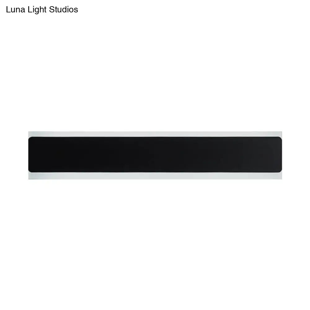 Black rectangular minimalist led wall lamp with white border designed as a bedroom sconce for contemporary decor