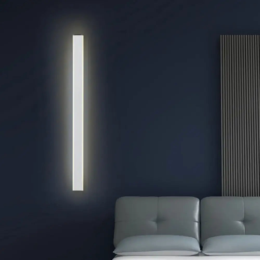 A sleek minimalist black and white led wall lamp with soft white illumination ideal for bedroom sconce lighting