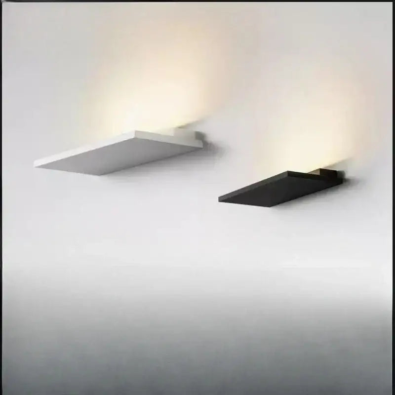 Minimalist black and white led wall light with flat rectangular design and angular edges for bedroom and living room decorbites led wall