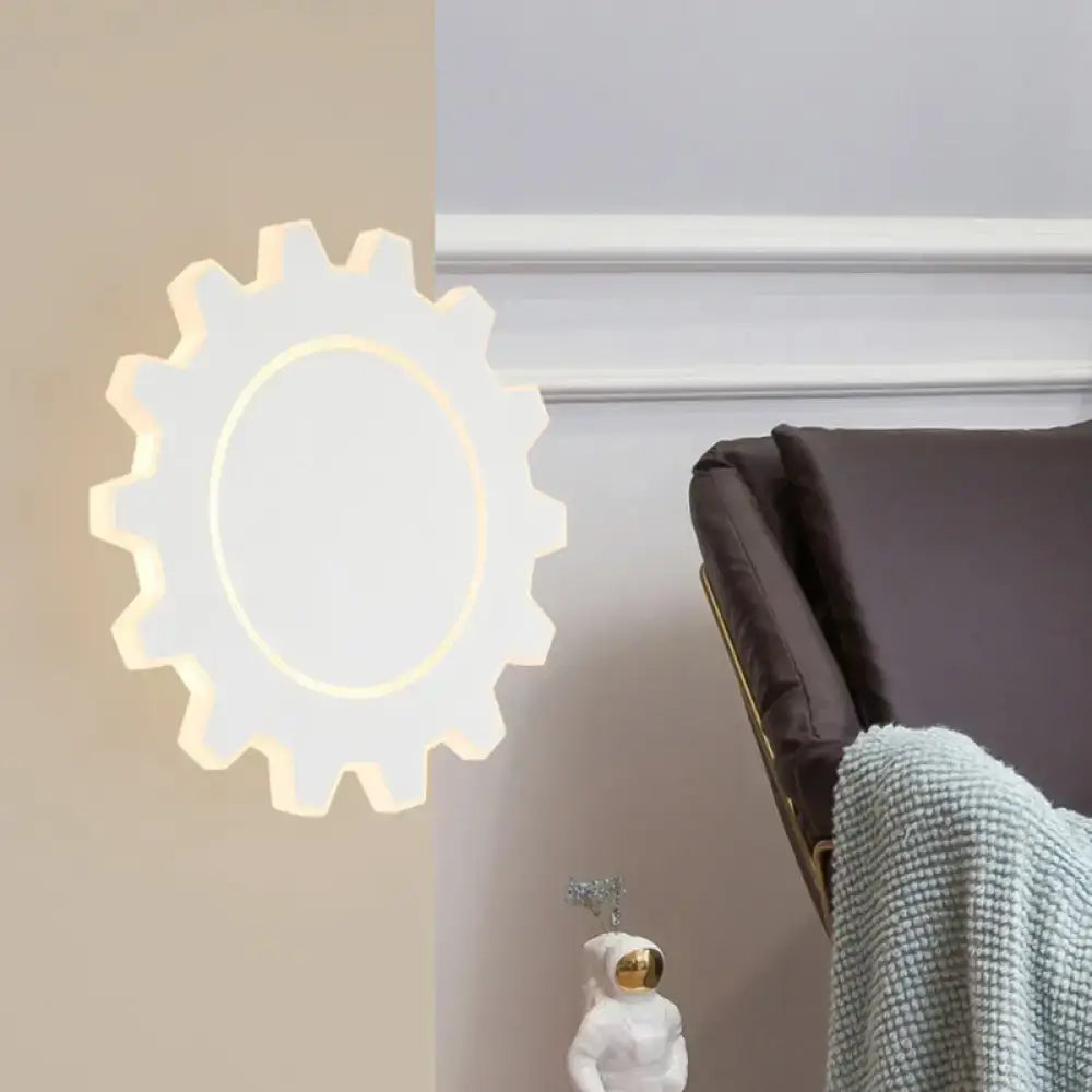 White gear-shaped led wall sconce with warm white light center for minimalist black white bedroom decor