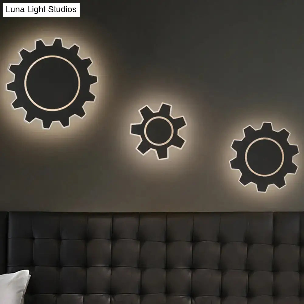 Minimalist black gear-shaped led wall sconces with warm white light edges for bedroom lighting in black white style