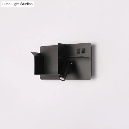 Minimalist black metal tubular wall light with matte finish, swivel head, bulb base, and integrated usb ports for reading