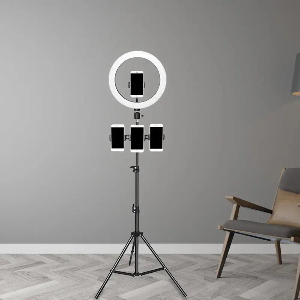 Minimalist black and white mobile phone holder with ring light and three phone holders on black tripod stand for bedroom use