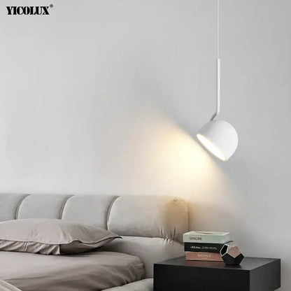 White yicolux pendant light with sleek curved stem in minimalist black and white modern pendant for dining room