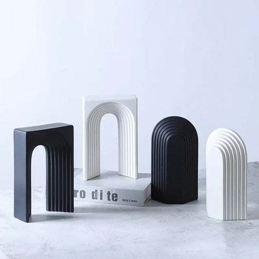 Minimalist black and white ceramic semicircular arch bookends with vertical ridges for living room decorbites geometric ceramic decor figurines