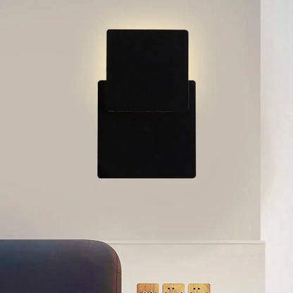 Black rectangular wall lamp with smd light source featuring a sleek minimalist design for bedroom use