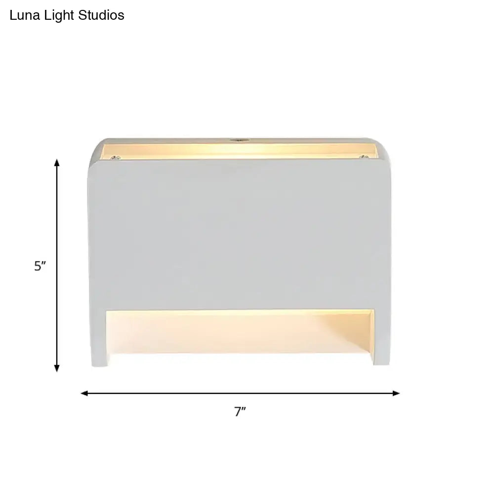 Minimalist box shape white wall mounted paper towel dispenser with modern white light fixture and warm led illumination