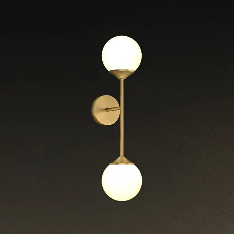 Minimalist brass led wall lamp with two frosted glass globe shades for dining room modern wall lighting
